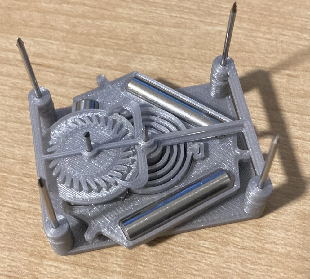 Early 3D-printed escapement prototype on guide rods
